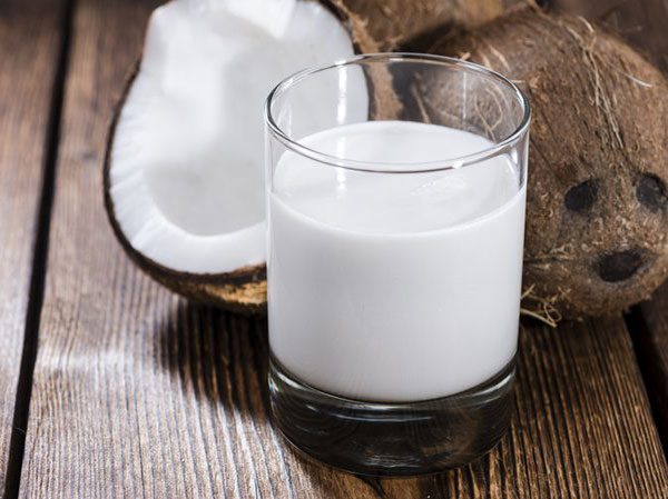 Coconut milk for frizzy hair on top of head curly hair